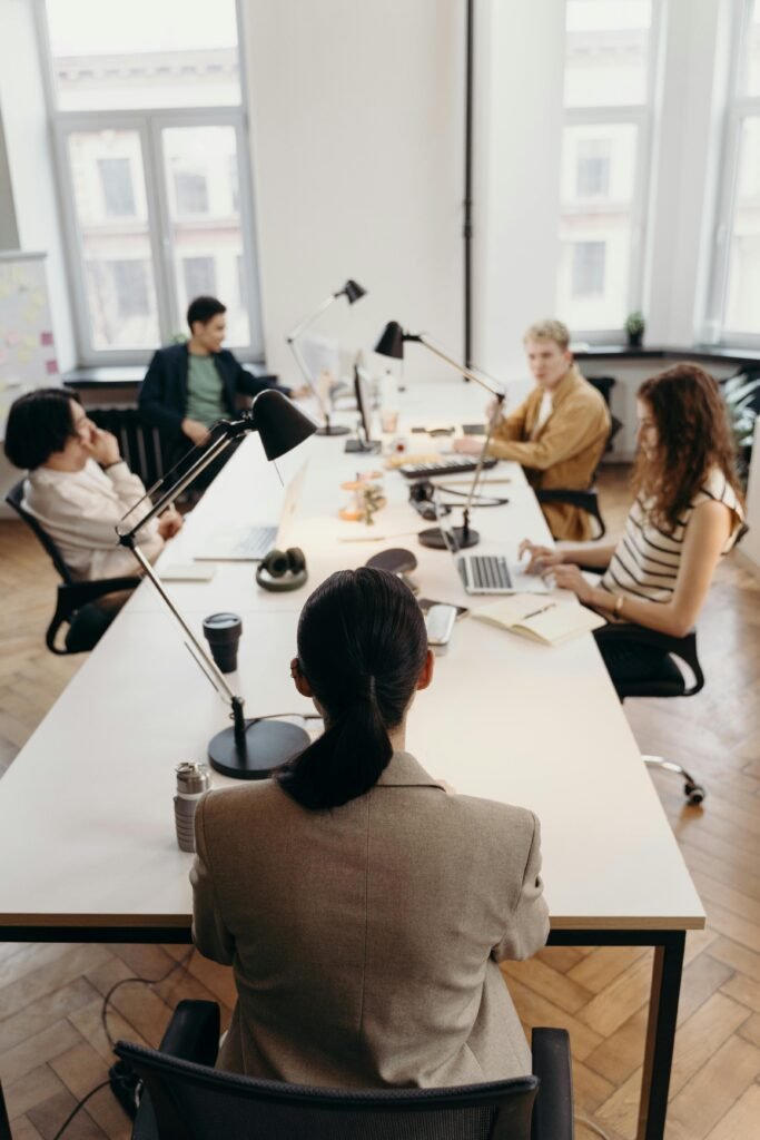 People collaborating at a work desk